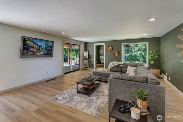 3327 170th Ave E, Lake Tapps, WA 98391 - living area featuring healthy amount of natural light, light wood-style floors, recessed lighting, and baseboards