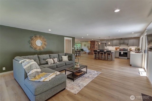 3327 170th Ave E, Lake Tapps, WA 98391 - living room featuring light wood-style floors, recessed lighting, and baseboards