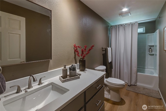 3327 170th Ave E, Lake Tapps, WA 98391 - full bath with vanity, wood finished floors, toilet, and shower / bath combo with shower curtain