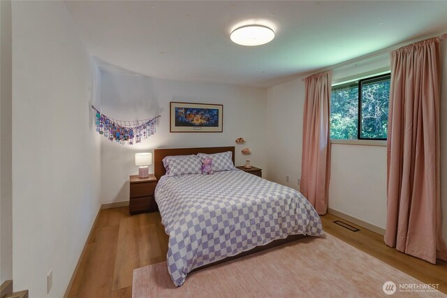 3327 170th Ave E, Lake Tapps, WA 98391 - bedroom with light wood-type flooring and baseboards