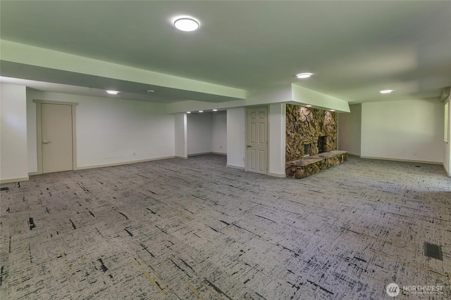 3327 170th Ave E, Lake Tapps, WA 98391 - finished below grade area with a stone fireplace, baseboards, and carpet floors