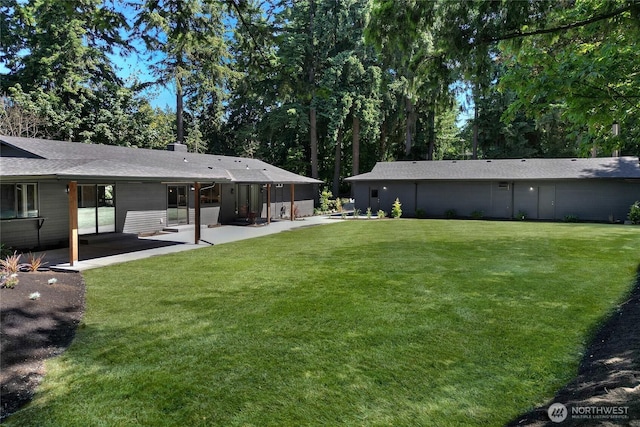 3327 170th Ave E, Lake Tapps, WA 98391 - view of grassy yard with a patio area