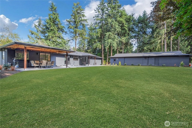 3327 170th Ave E, Lake Tapps, WA 98391 - view of green lawn featuring a patio area
