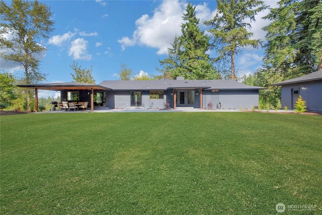 3327 170th Ave E, Lake Tapps, WA 98391 - back of house with a patio area and a lawn