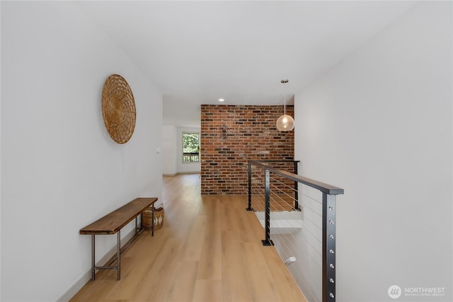 3327 170th Ave E, Lake Tapps, WA 98391 - hallway with light wood-style flooring, an upstairs landing, brick wall, and recessed lighting