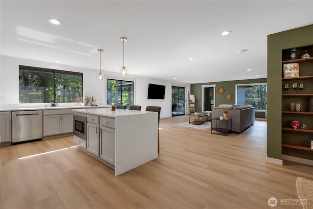 3327 170th Ave E, Lake Tapps, WA 98391 - kitchen featuring stainless steel appliances, gray cabinetry, light countertops, recessed lighting, and light wood-style flooring
