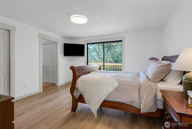 3327 170th Ave E, Lake Tapps, WA 98391 - bedroom featuring light wood finished floors and access to exterior