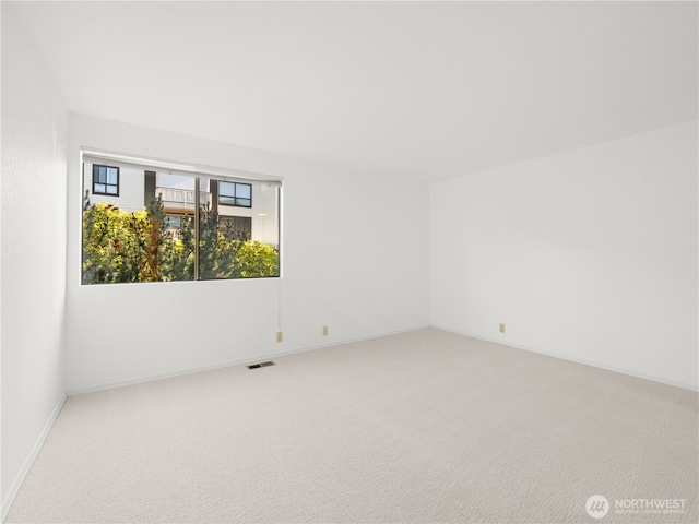 1113 5th Ave S Unit 107, Edmonds, WA 98020 - unfurnished room with carpet floors and baseboards