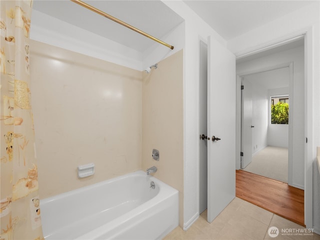1113 5th Ave S Unit 107, Edmonds, WA 98020 - bathroom with shower / bath combination with curtain and tile patterned flooring
