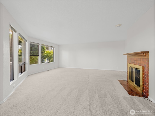 1113 5th Ave S Unit 107, Edmonds, WA 98020 - unfurnished living room with a fireplace and carpet floors