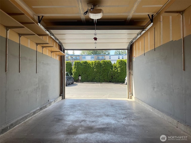 1113 5th Ave S Unit 107, Edmonds, WA 98020 - garage featuring a garage door opener