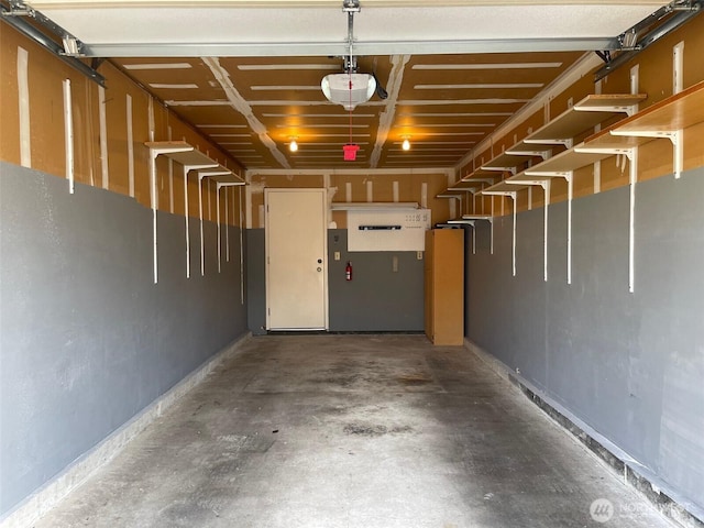 1113 5th Ave S Unit 107, Edmonds, WA 98020 - garage with a garage door opener and baseboards