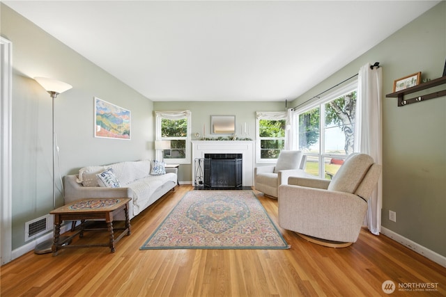 2348 Rainier St, Walla Walla, WA 99362 - living area with plenty of natural light, wood finished floors, and a fireplace with flush hearth