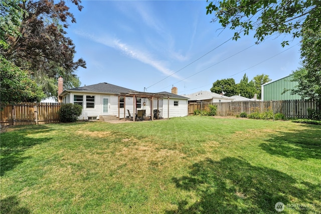 2348 Rainier St, Walla Walla, WA 99362 - rear view of property featuring a chimney, a fenced backyard, entry steps, and a patio