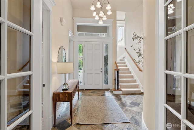 8407 SE 69th Pl, Mercer Island, WA 98040 - entrance foyer featuring plenty of natural light, stairway, baseboards, and a chandelier
