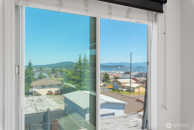 910 34th St Unit 302, Anacortes, WA 98221 - doorway to outside with a mountain view and expansive windows