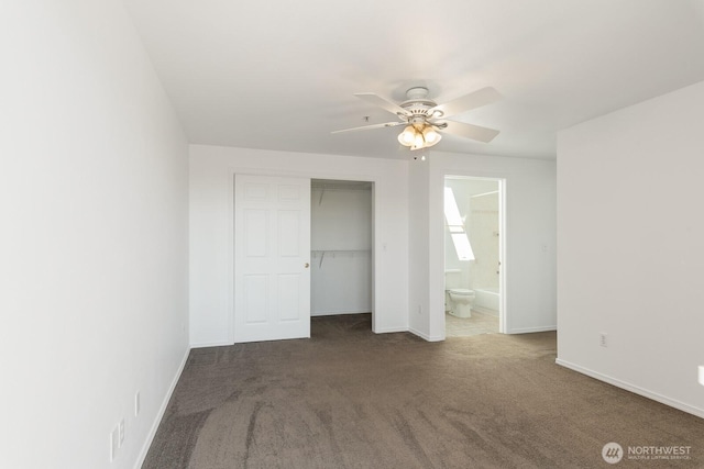 910 34th St Unit 302, Anacortes, WA 98221 - unfurnished bedroom featuring carpet floors, baseboards, a closet, ensuite bathroom, and ceiling fan