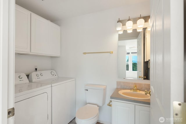 910 34th St Unit 302, Anacortes, WA 98221 - bathroom featuring washing machine and dryer, vanity, and toilet