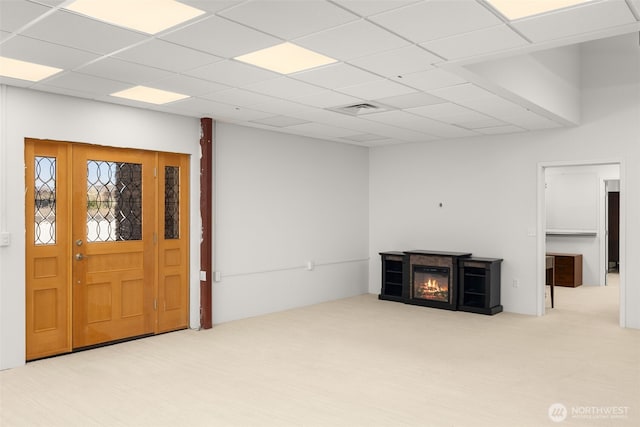 431 Airport Way SW, Mattawa, WA 99349 - unfurnished living room featuring a glass covered fireplace and carpet flooring