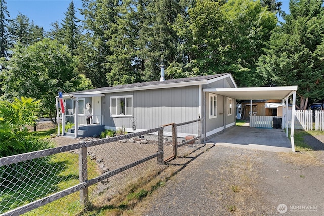 101 Shenandoah Dr, Silverlake, WA 98645 - manufactured / mobile home featuring dirt driveway and a carport