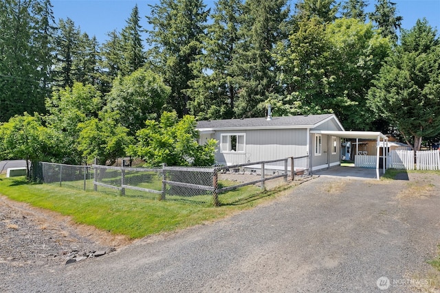 101 Shenandoah Dr, Silverlake, WA 98645 - manufactured / mobile home with a carport, driveway, and a gate