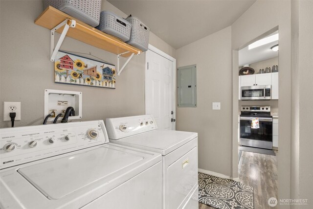 101 Shenandoah Dr, Silverlake, WA 98645 - laundry room with electric panel, washing machine and dryer, and light wood-style floors