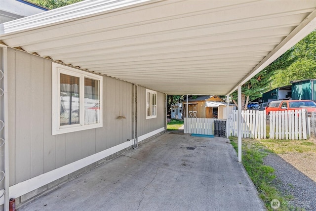 101 Shenandoah Dr, Silverlake, WA 98645 - view of patio featuring a storage unit and a carport