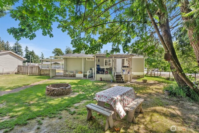 101 Shenandoah Dr, Silverlake, WA 98645 - rear view of property with an outdoor fire pit