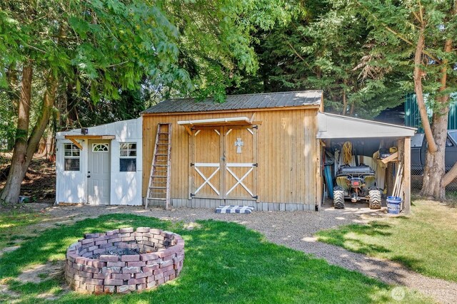 101 Shenandoah Dr, Silverlake, WA 98645 - view of shed with an outdoor fire pit