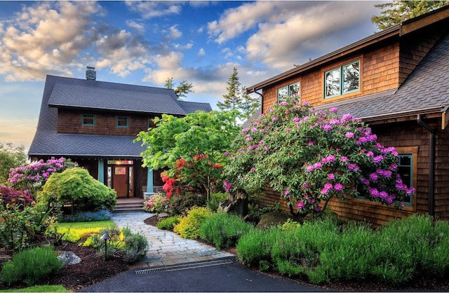 385 Sunset Ave, Orcas Island, WA 98245 - view of front of house with roof with shingles and a chimney