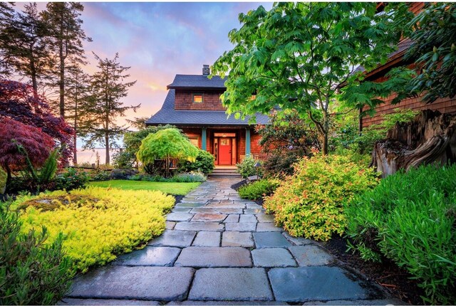 385 Sunset Ave, Orcas Island, WA 98245 - view of front facade with a chimney and a shingled roof