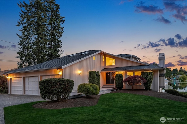 3604 Serene Way, Lynnwood, WA 98087 - mid-century inspired home featuring a front yard, an attached garage, asphalt driveway, and a chimney