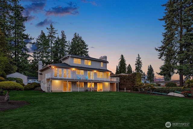 3604 Serene Way, Lynnwood, WA 98087 - back of house at dusk with a chimney, a yard, and stairway