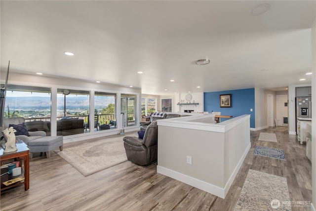 3418 Mari Lane Dr, Wenatchee, WA 98801 - living area featuring light wood finished floors, recessed lighting, and a fireplace