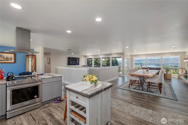 3418 Mari Lane Dr, Wenatchee, WA 98801 - kitchen with stainless steel range with electric stovetop, island exhaust hood, gray cabinetry, plenty of natural light, and recessed lighting