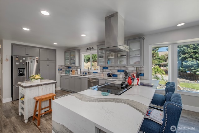 3418 Mari Lane Dr, Wenatchee, WA 98801 - kitchen featuring gray cabinets, island exhaust hood, stainless steel appliances, a peninsula, and recessed lighting
