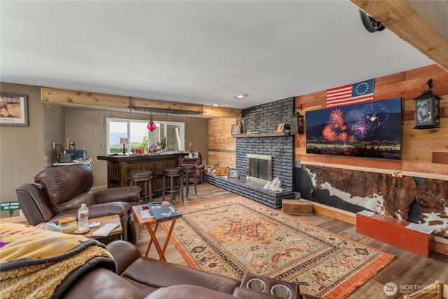 3418 Mari Lane Dr, Wenatchee, WA 98801 - living room featuring wooden walls, wood finished floors, and a fireplace