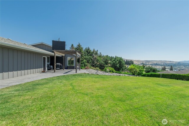 3418 Mari Lane Dr, Wenatchee, WA 98801 - view of grassy yard with a pergola and a patio