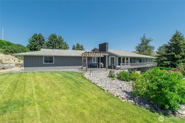 3418 Mari Lane Dr, Wenatchee, WA 98801 - back of property with a pergola, a yard, a chimney, and a patio
