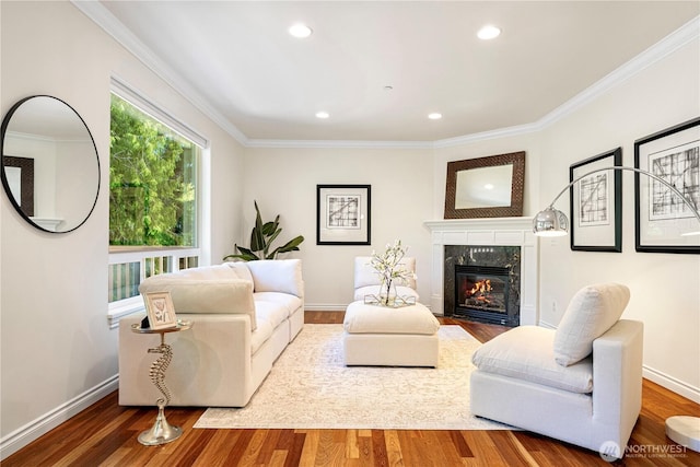 17445 NE 28th St, Redmond, WA 98052 - living room with wood finished floors, crown molding, a fireplace, and recessed lighting