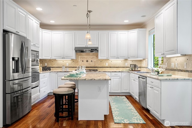 17445 NE 28th St, Redmond, WA 98052 - kitchen featuring stainless steel appliances, under cabinet range hood, white cabinets, dark wood finished floors, and crown molding