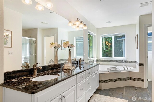 17445 NE 28th St, Redmond, WA 98052 - full bathroom with double vanity, a shower stall, a bath, and tile patterned flooring