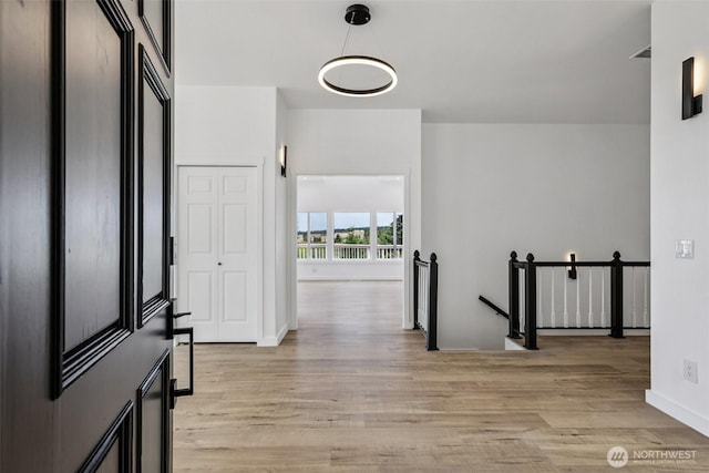 2805 Chambers Bay Dr, Steilacoom, WA 98388 - corridor with an upstairs landing and light wood finished floors