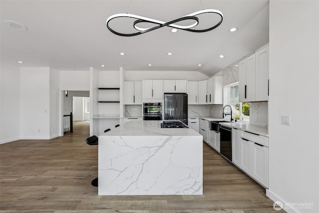 2805 Chambers Bay Dr, Steilacoom, WA 98388 - kitchen with appliances with stainless steel finishes, recessed lighting, tasteful backsplash, a kitchen island, and white cabinetry