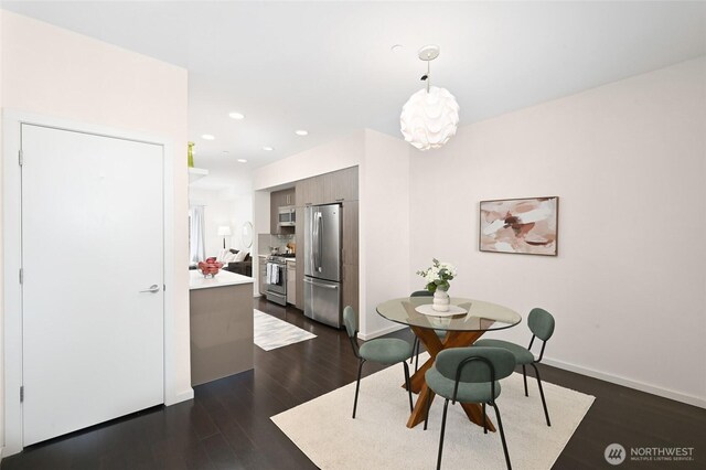 8505A 14th Ave NW, Seattle, WA 98117 - dining area with dark wood finished floors, recessed lighting, and a chandelier