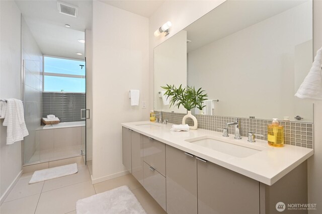 8505A 14th Ave NW, Seattle, WA 98117 - bathroom with double vanity, a shower stall, tile patterned flooring, and tasteful backsplash
