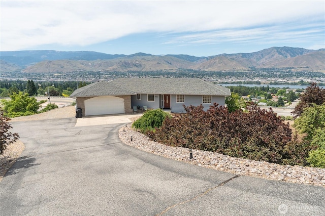 582 Lower Daniels Dr, East Wenatchee, WA 98802 - view of front of home with a mountain view, an attached garage, and driveway