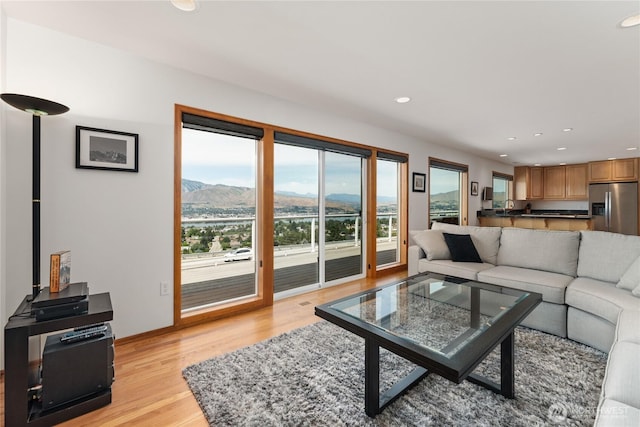 582 Lower Daniels Dr, East Wenatchee, WA 98802 - living area featuring a mountain view, light wood-type flooring, and recessed lighting