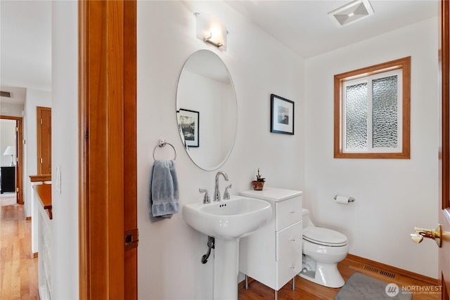582 Lower Daniels Dr, East Wenatchee, WA 98802 - bathroom with wood finished floors and toilet