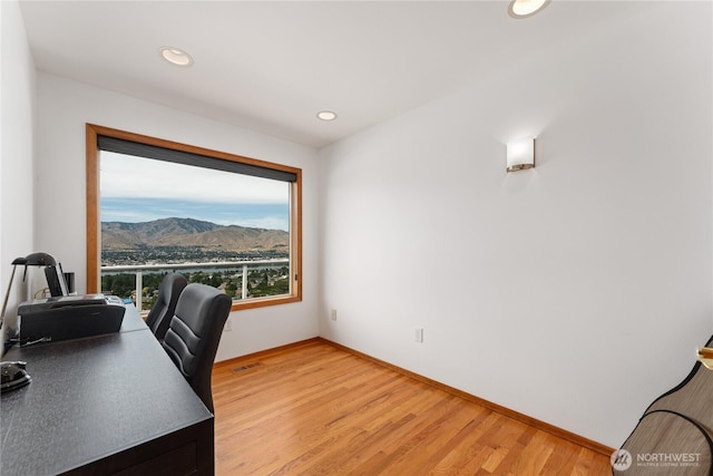 582 Lower Daniels Dr, East Wenatchee, WA 98802 - office space featuring light wood-type flooring, a mountain view, and recessed lighting